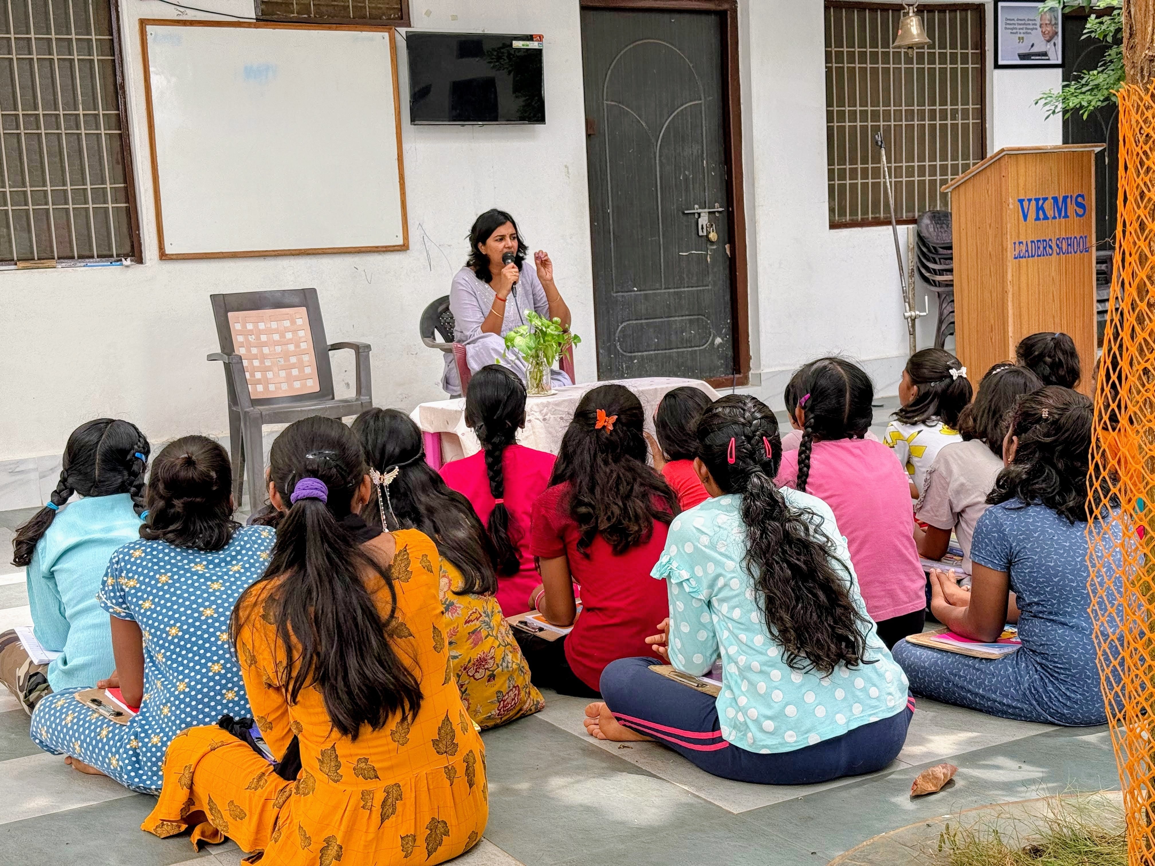 Dr. Raga speaking to girls